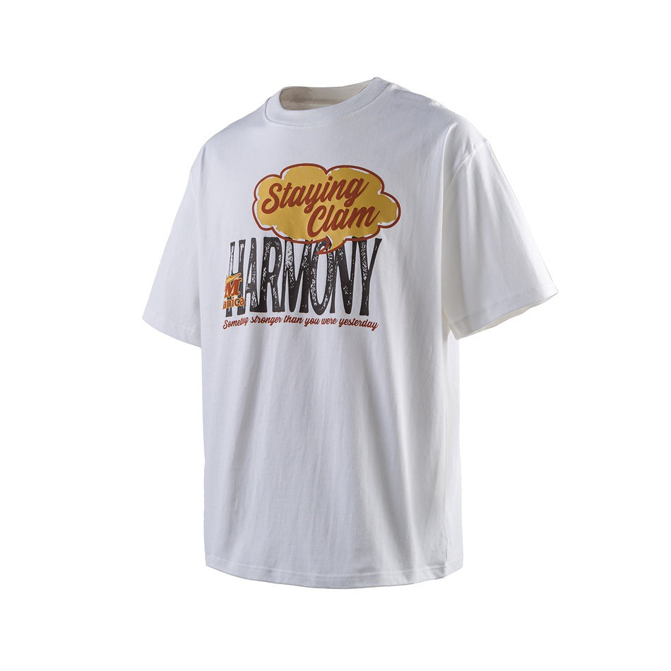 White short-sleeve T-shirt with a colorful “Staying Calm” and “HARMONY” graphic on the front.