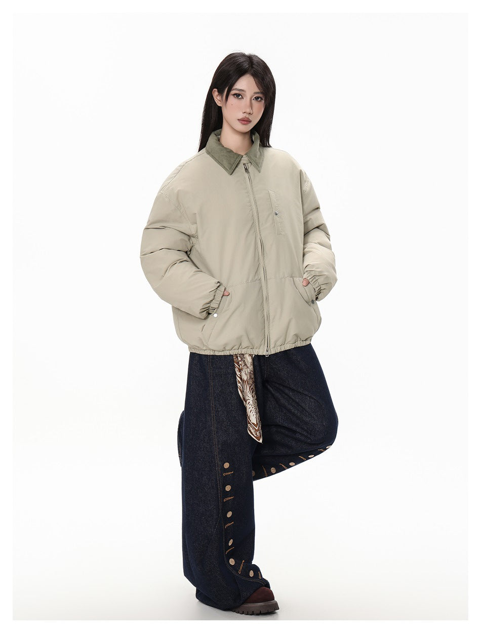 Full-length model wearing a light beige zip jacket with an olive collar and dark wide-leg jeans.
