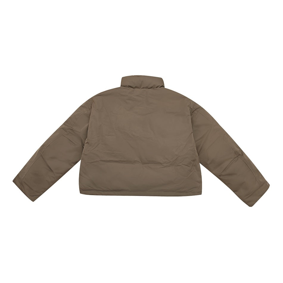 Back view of brown cropped stand-collar jacket with paneled sleeves, flat lay
