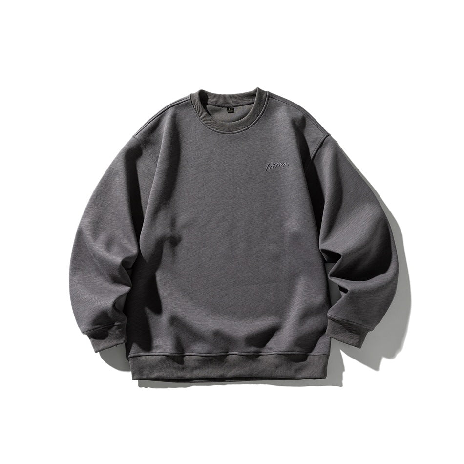 Charcoal gray crew neck sweatshirt flat lay, front view, with ribbed trim and small chest embroidery