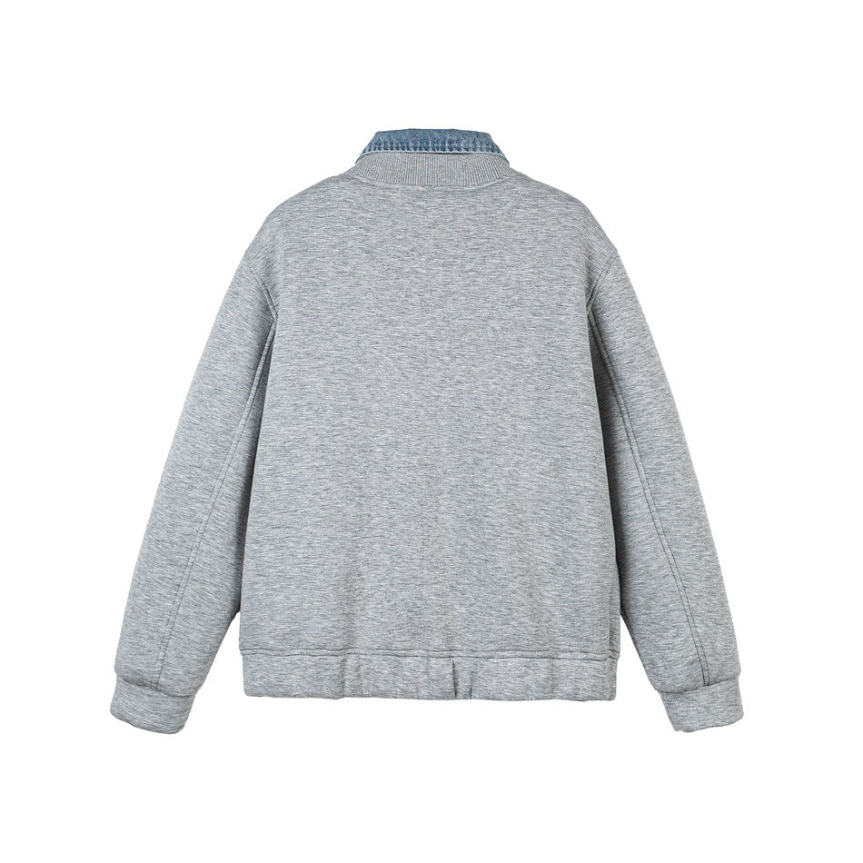 Back view of a light gray jacket with ribbed cuffs and hem and a blue denim collar.