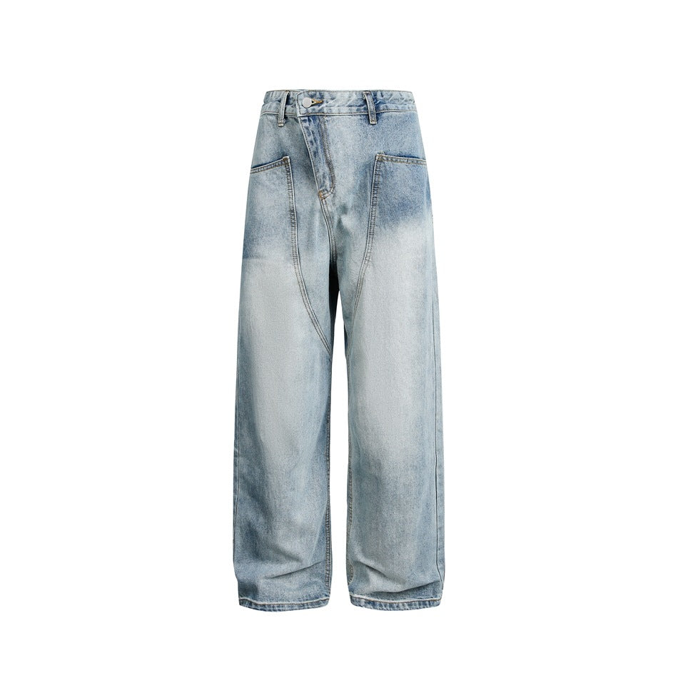 Washed light blue wide-leg jeans with diagonal waistband and curved front seams, flat front view