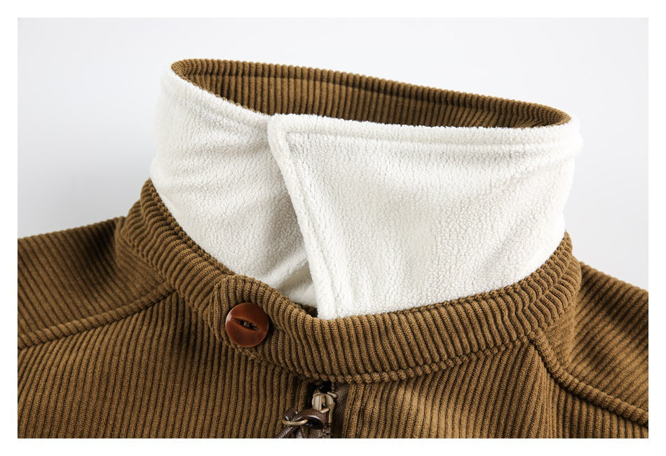 Close-up of the camel-brown ribbed jacket's raised collar, showing its white fleece-like lining, button, and zipper top.