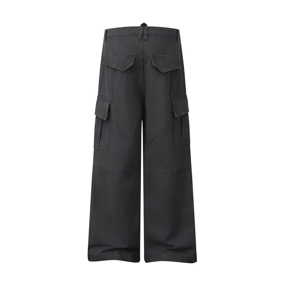 Back view of charcoal wide-leg cargo pants with flap pockets, cargo pockets, and curved seat panels.