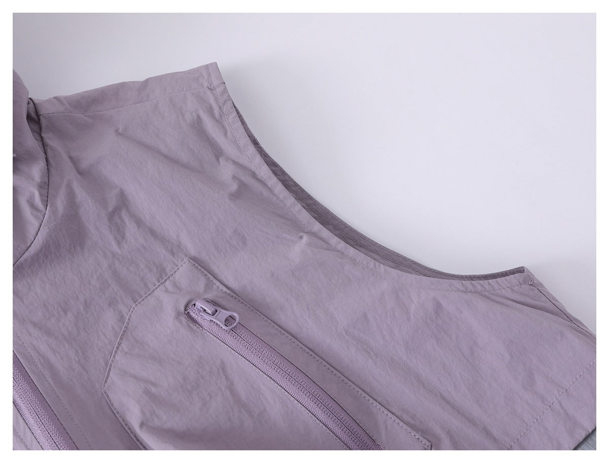 Close-up of a lavender jacket panel with a slanted zip pocket and curved seam.