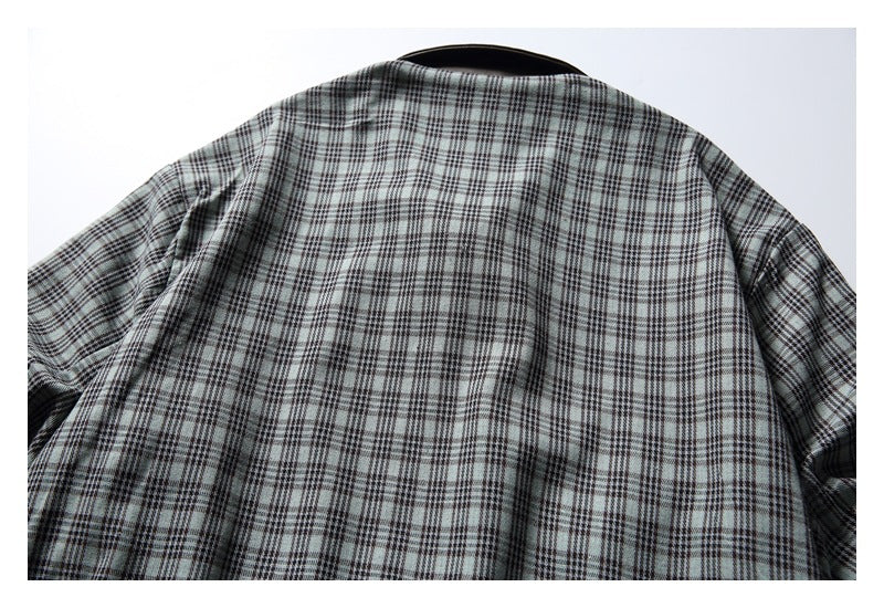 Back view of a gray plaid long-sleeved garment, laid flat against a white background.