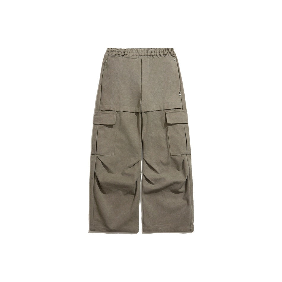 Gray wide-leg cargo pants flat lay, front view, with elastic waist and flap side pockets