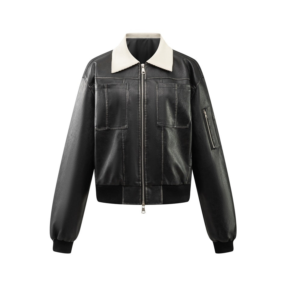 Black cropped faux-leather bomber jacket with cream ribbed collar, front zipper, chest patch pockets and sleeve zip pocket