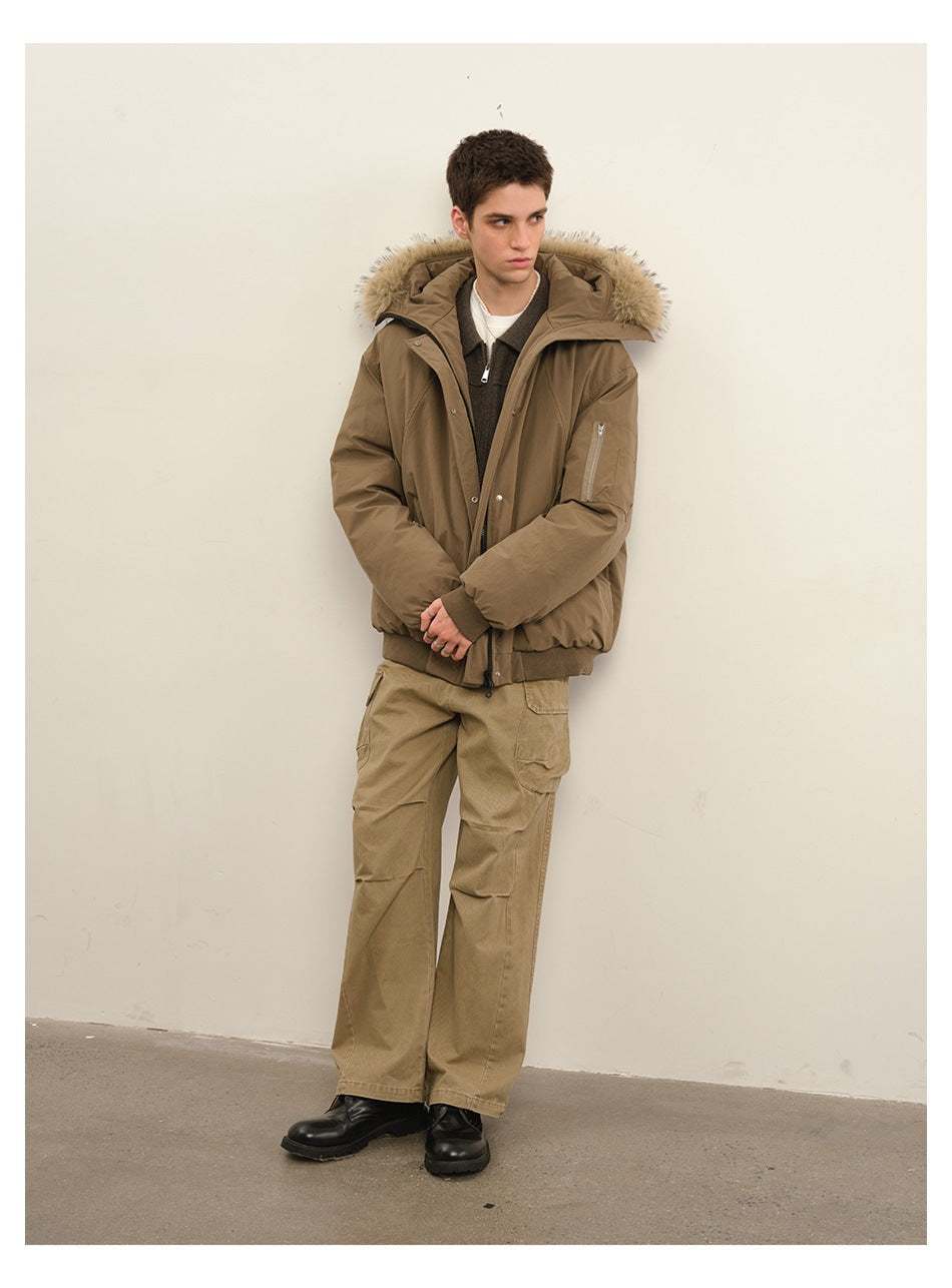 Model wearing khaki cargo pants with a hooded jacket with fur-like trim and black boots