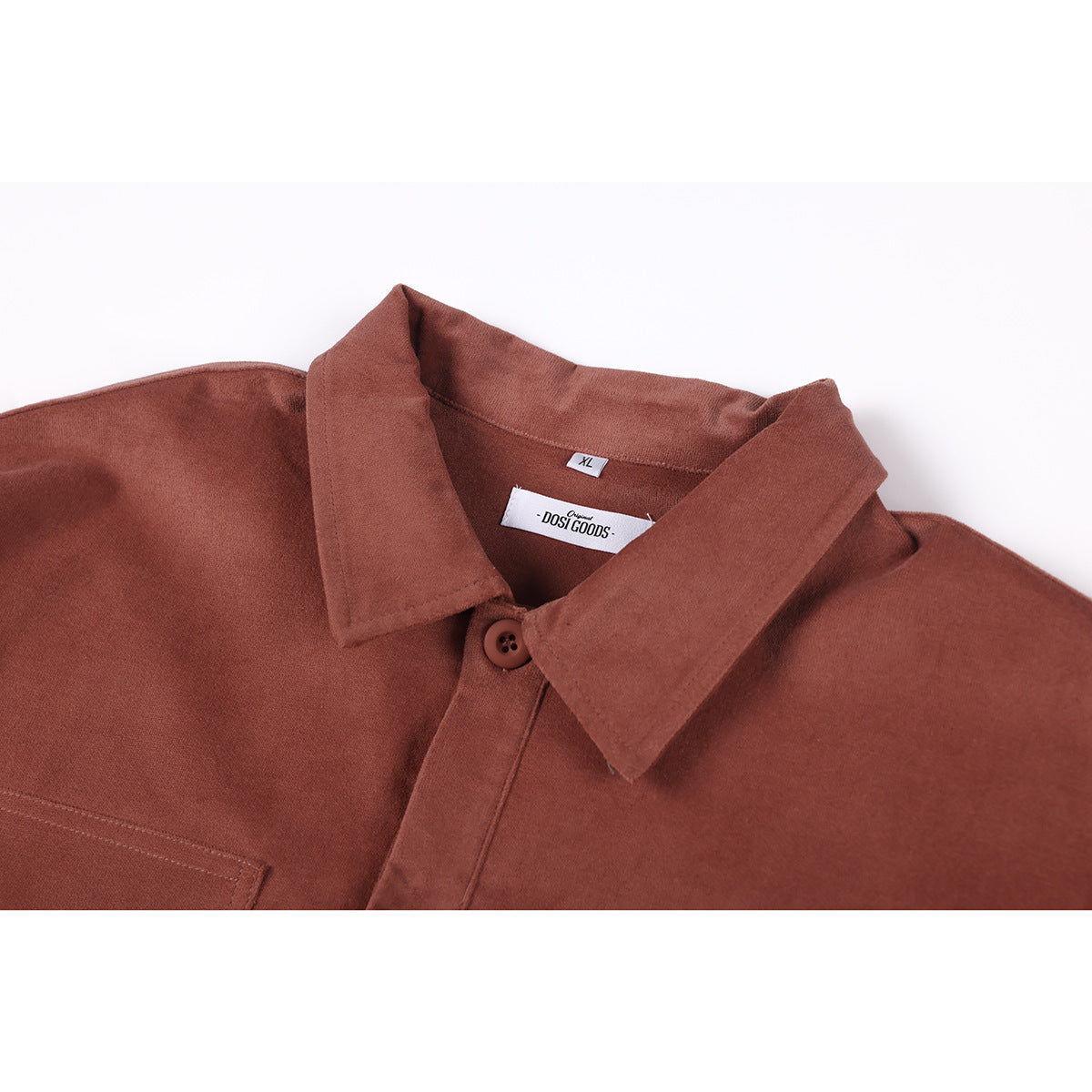 Close-up of a rust-brown shirt collar, top button, and sewn neck labels.