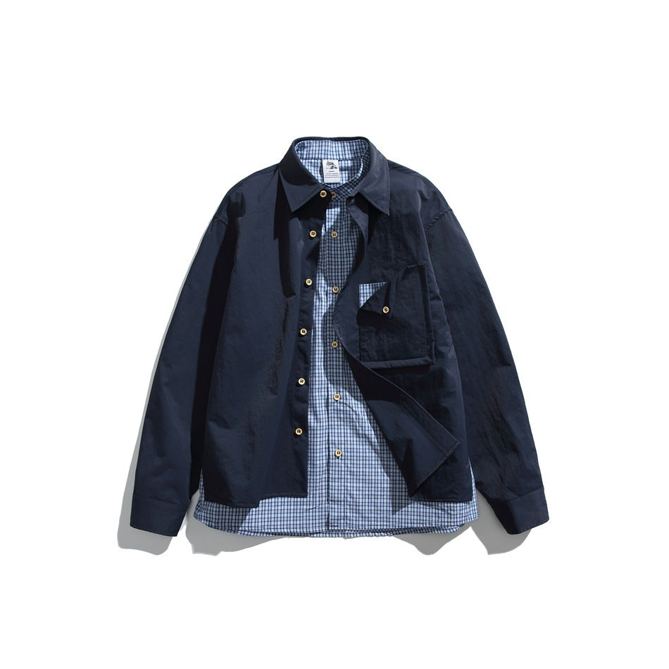 Navy blue long-sleeve shirt opened to show a blue gingham underlayer, flat lay with flap chest pocket