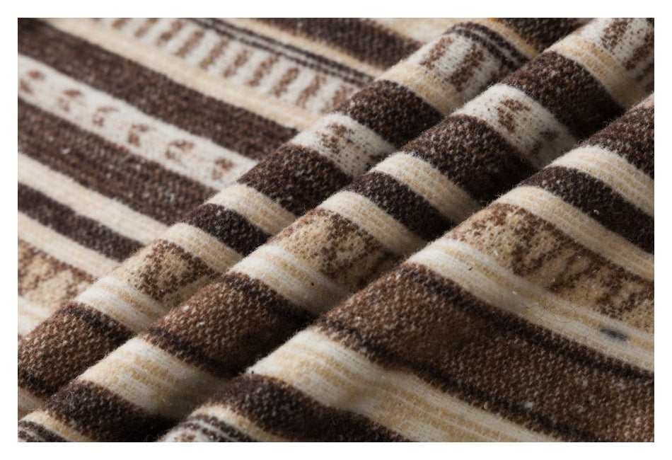 Close-up showing the textured brown, cream, and tan striped fabric draped in soft folds.