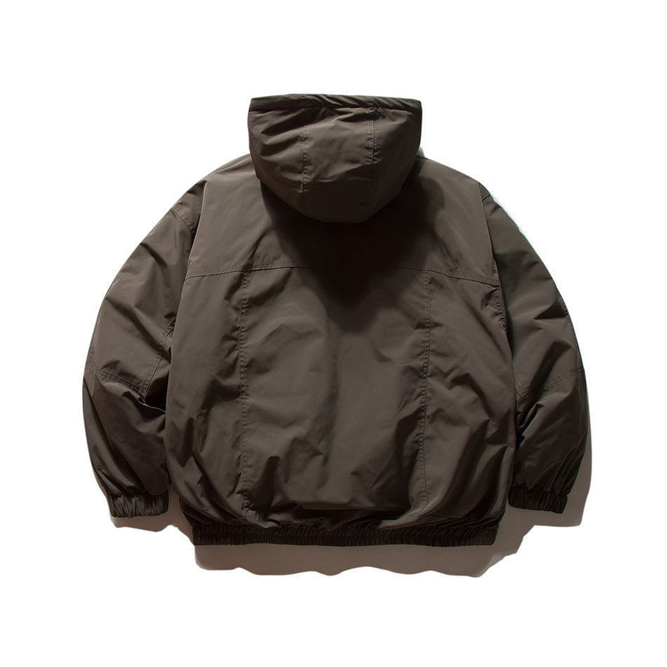 Back view of a charcoal-brown hooded jacket with gathered cuffs and hem.