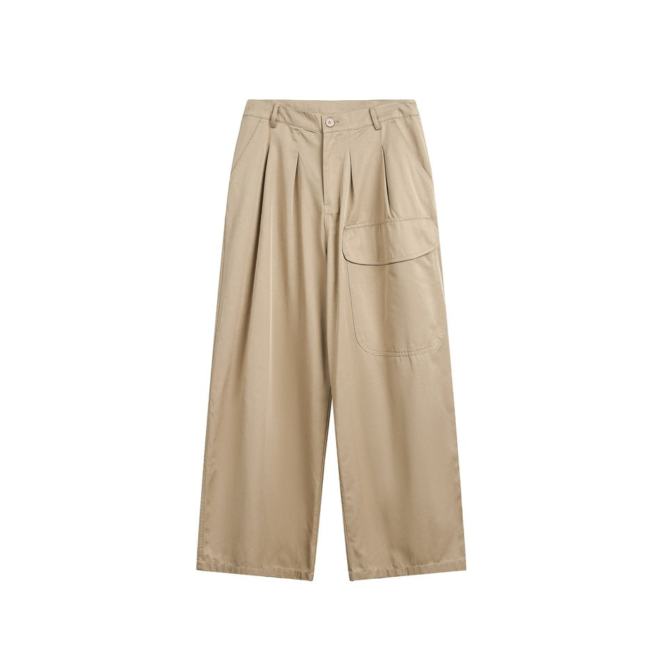 Khaki wide-leg pleated pants with a large flap pocket on one leg, flat front view on white background