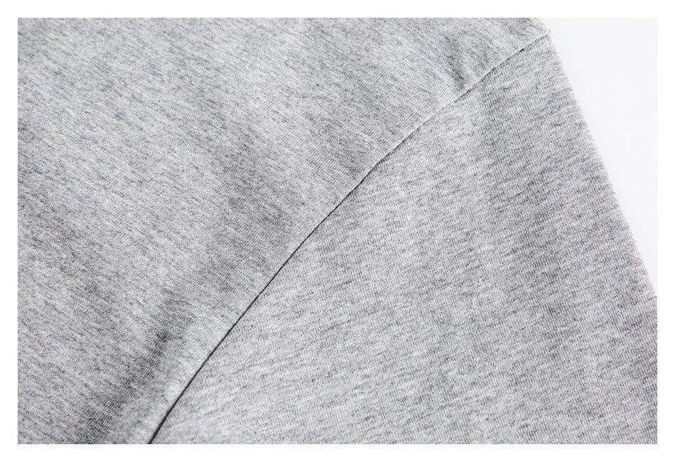 Close-up of the heather gray shirt's sleeve seam and fabric texture.
