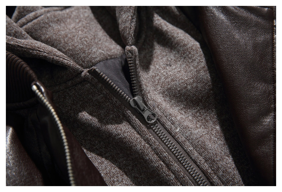 Close-up of the hooded jacket's gray-brown inner zip layer and dark zipper against the brown exterior.