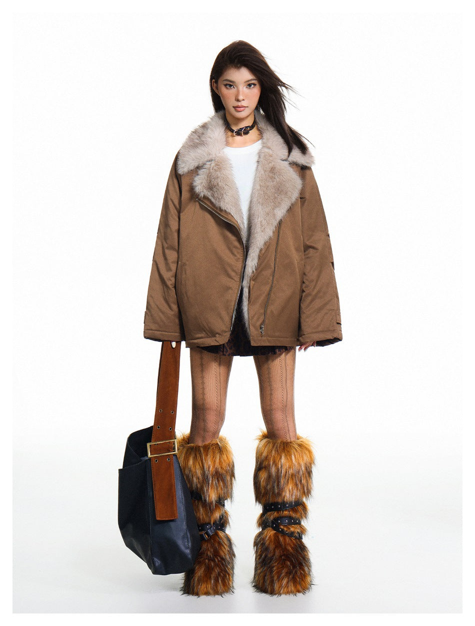 Model wearing the brown jacket open over a white top and leopard skirt, with a large faux-fur-look collar and fur leg warmers