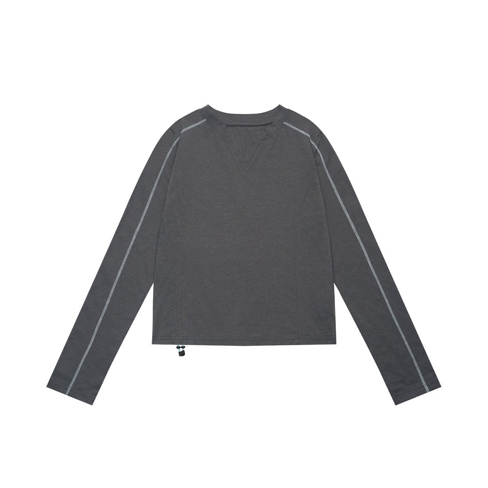 Dark gray cropped long-sleeve top flat lay with light gray-blue sleeve stitching and a hem drawstring toggle