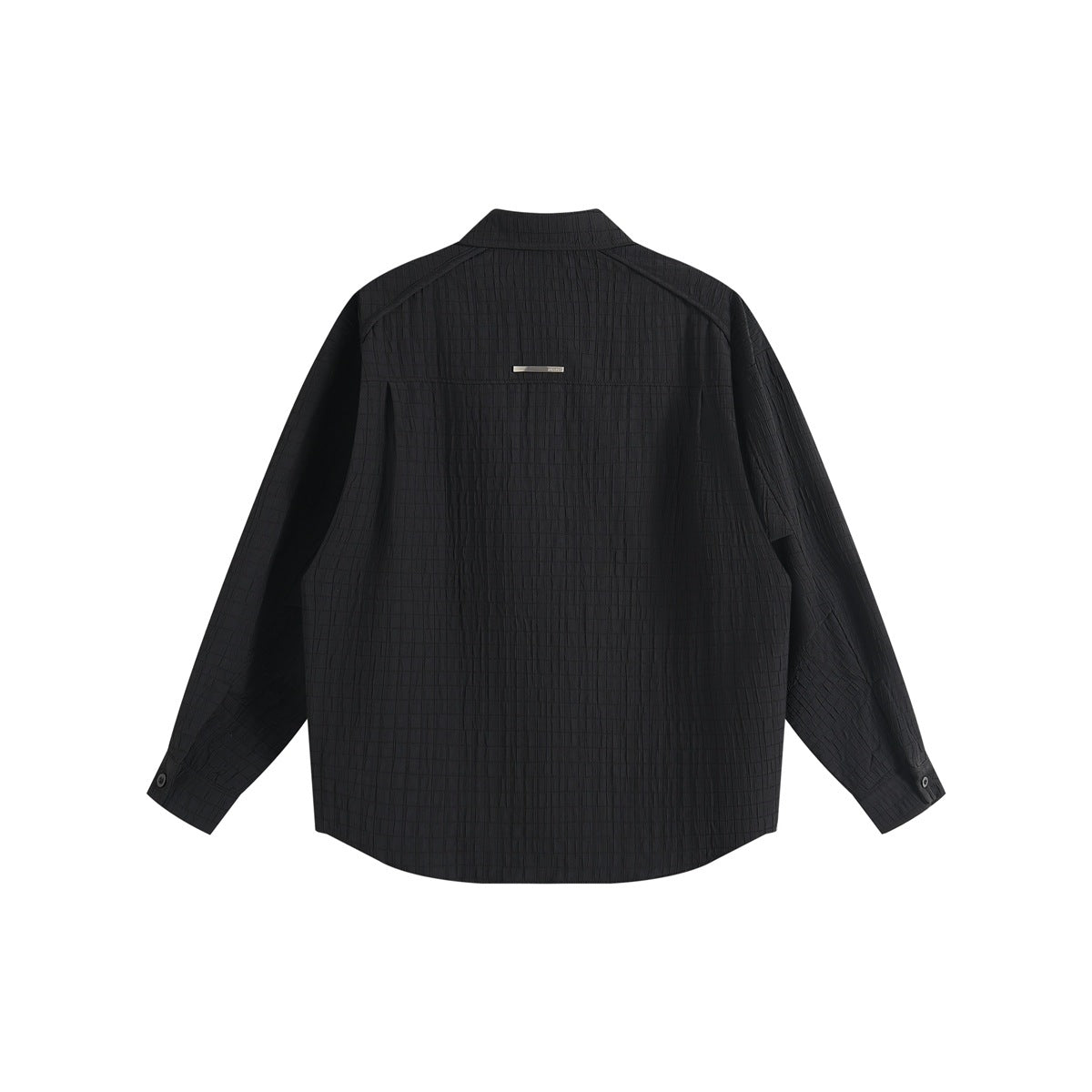 Back view of a black long-sleeve shirt with a pointed collar, curved hem, and small metal detail.