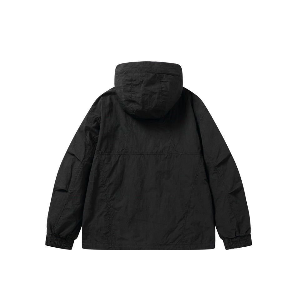 Back view of a black hooded jacket with a horizontal seam and elasticated cuffs.