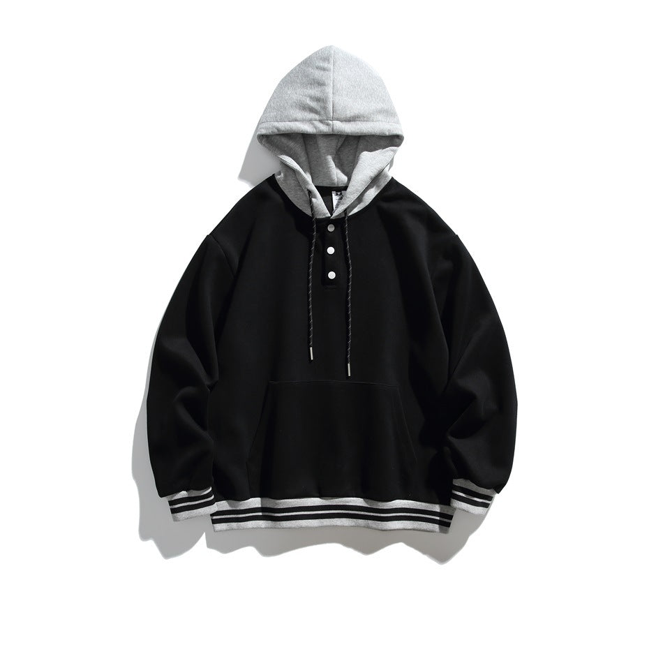 Flat-lay black hoodie with heather gray hood, three snaps, kangaroo pocket and gray striped ribbed trim