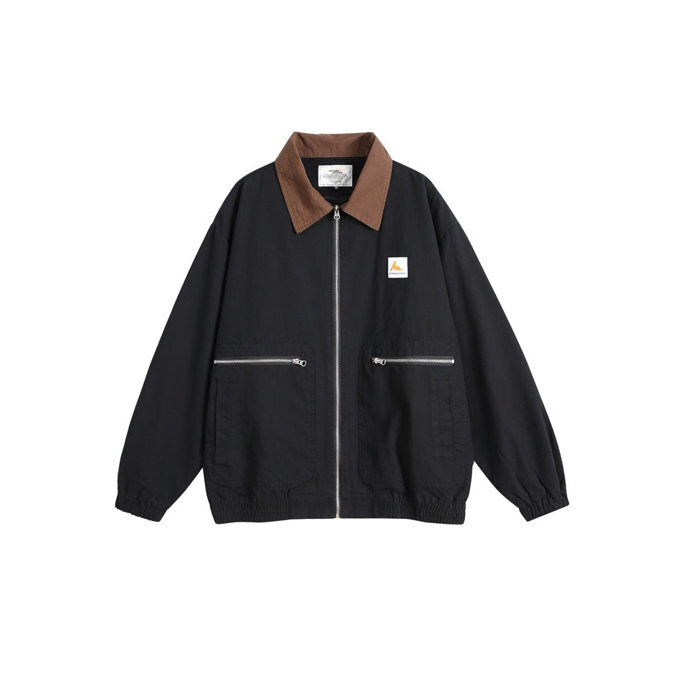 Black zip-front jacket with brown collar, two zippered patch pockets and elastic cuffs and hem, flat view