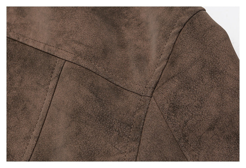 Close-up of dark brown garment panels with curved shoulder seams and stitching.