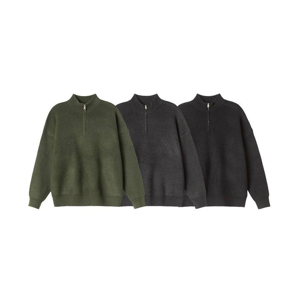 Three quarter-zip sweaters displayed together in olive, charcoal gray and black.