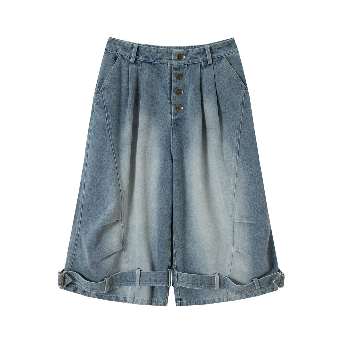 Front of faded blue wide-leg denim shorts with pleats, four-button fly, side pockets and buckled hem straps
