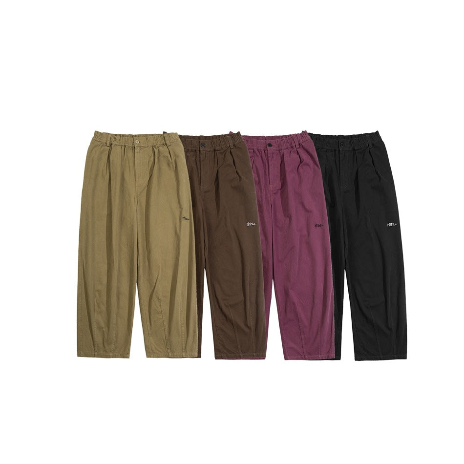 Four pairs of wide-leg pants shown together in khaki, brown, mauve, and black.