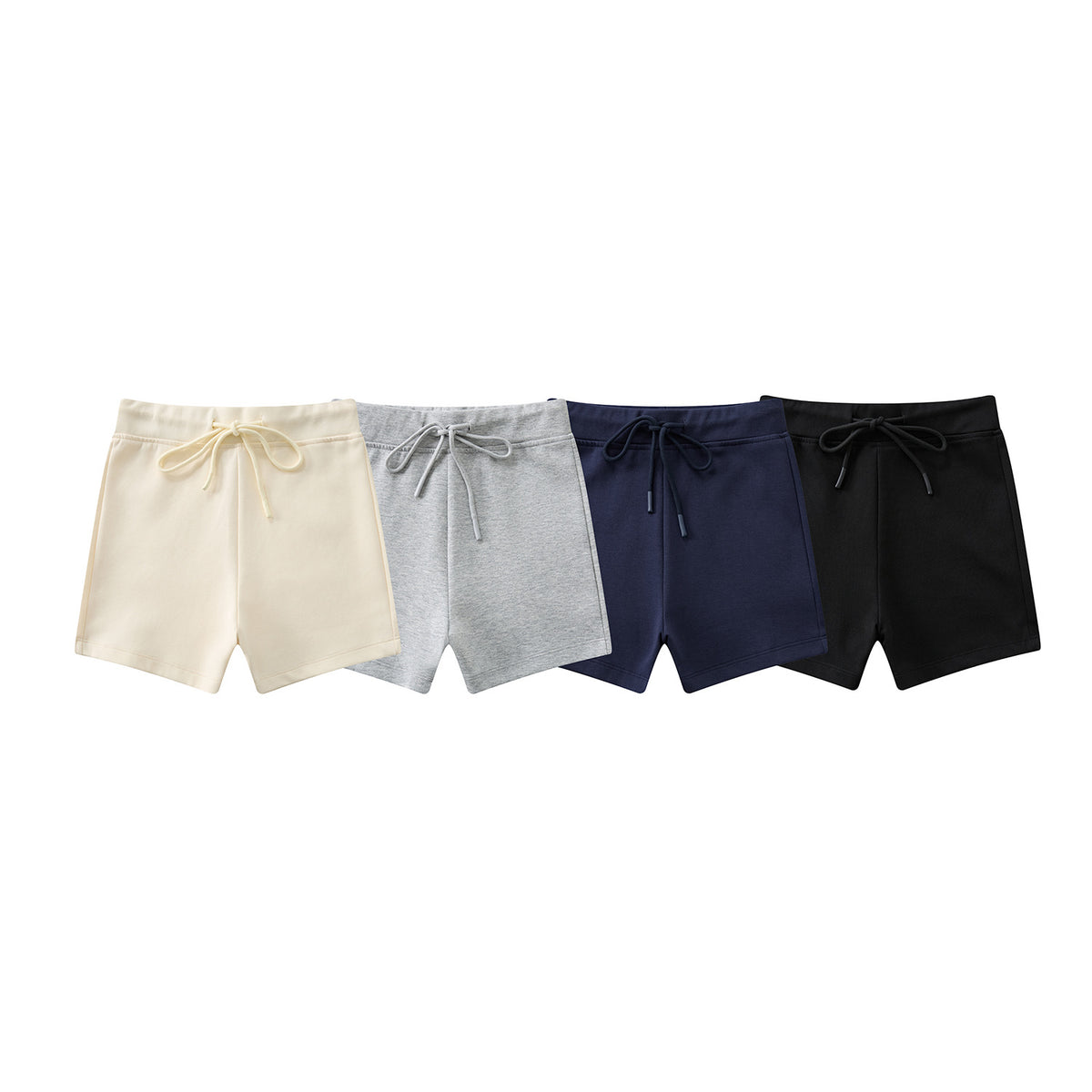 Four pairs of drawstring shorts arranged together in cream, light gray, navy, and black.