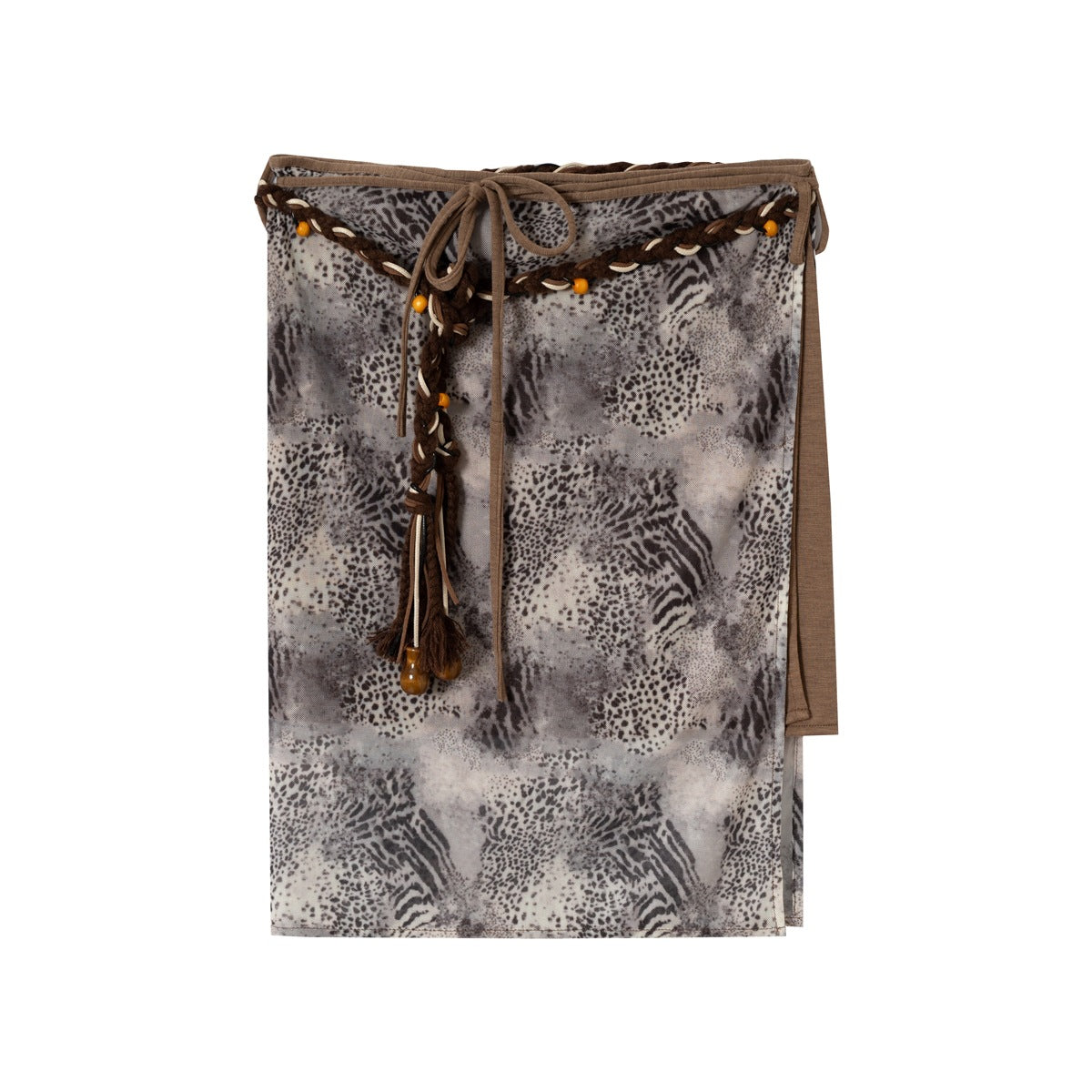 Flat lay of a gray and brown animal print wrap skirt with braided beaded cord tie and tassel on a white background