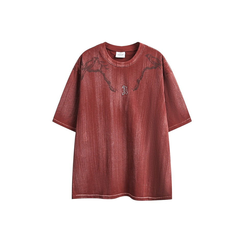 Red short-sleeve crew-neck T-shirt with streaky brushed finish, bird-and-branch graphic and small gothic A emblem