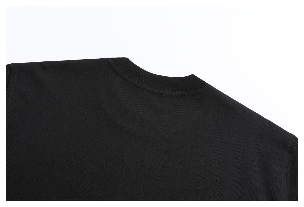 Close-up of the plain back and crew neckline of a black T-shirt.