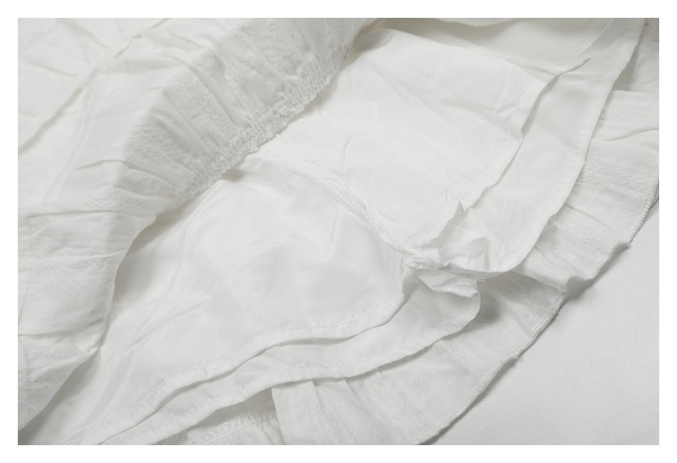 Close-up of the white skirt's interior lining and gathered seam.