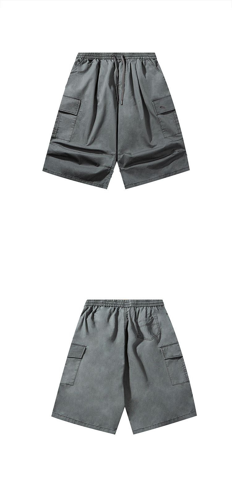 Charcoal gray wide-leg cargo shorts shown from the front above and back below, with elastic waist and side pockets.