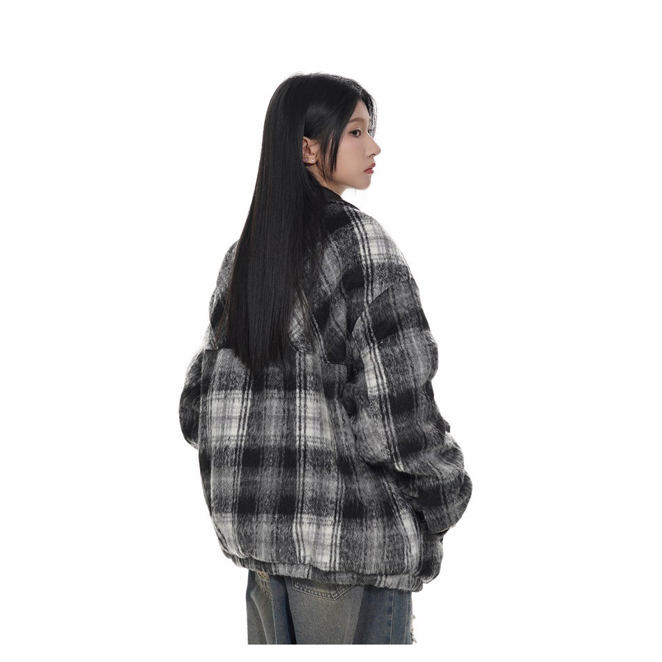 Model shown from behind wearing an oversized black, gray, and white plaid jacket.