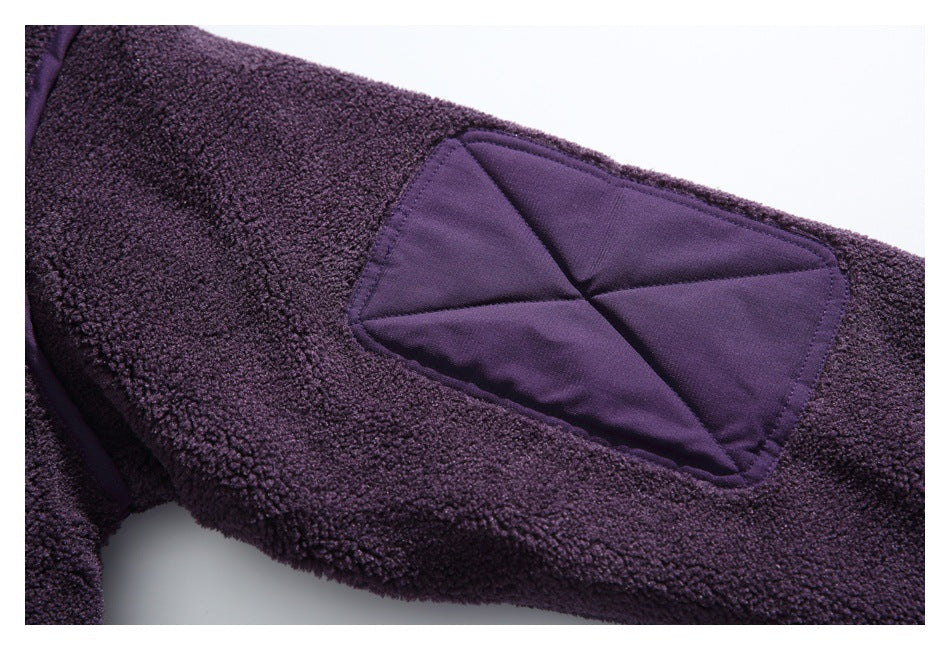 Close-up of a smooth purple diamond-stitched patch on deep purple fleece.
