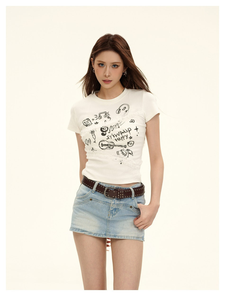 Model wearing a white short-sleeve tee with black music graphics and lace trim, paired with a light denim mini skirt.
