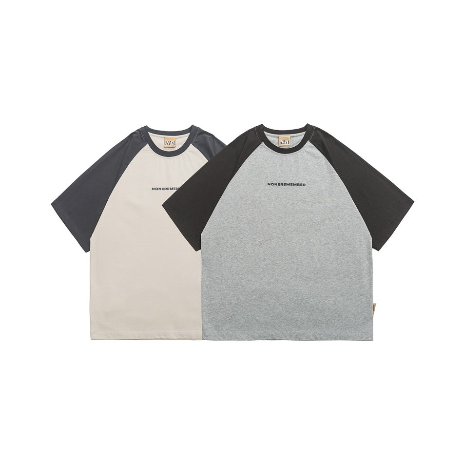 Two short-sleeve raglan T-shirts: cream with dark sleeves and heather gray with black sleeves.