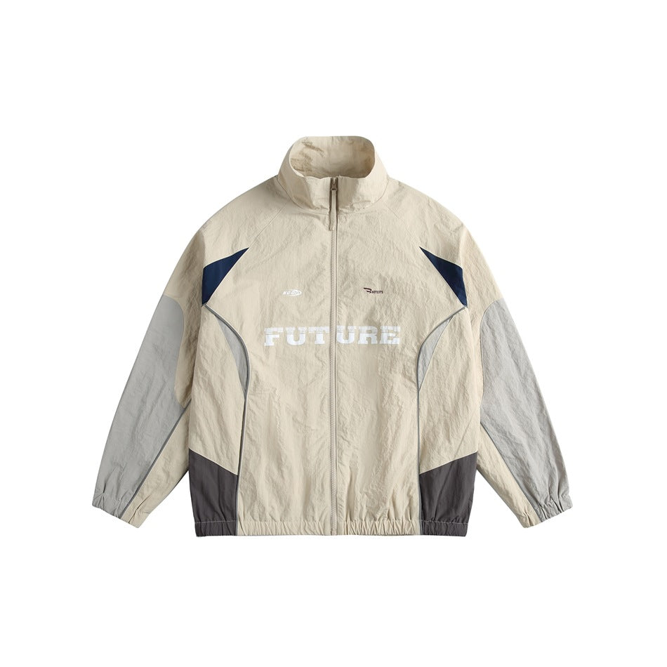 Beige track-style jacket with gray sleeves, navy accents, dark gray hem panels and white FUTURE chest print, front view