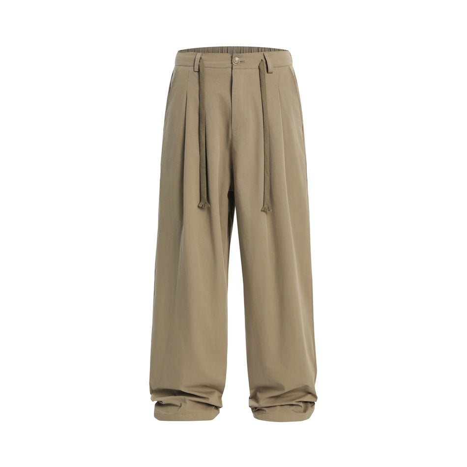 Khaki wide-leg pleated trousers with button front and long drawcord ties, flat front view