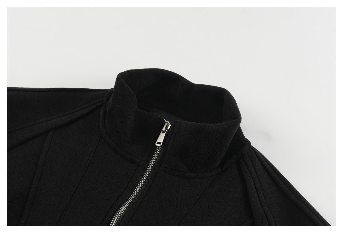 Close-up of a black sweatshirt jacket's tall collar and silver front zipper.