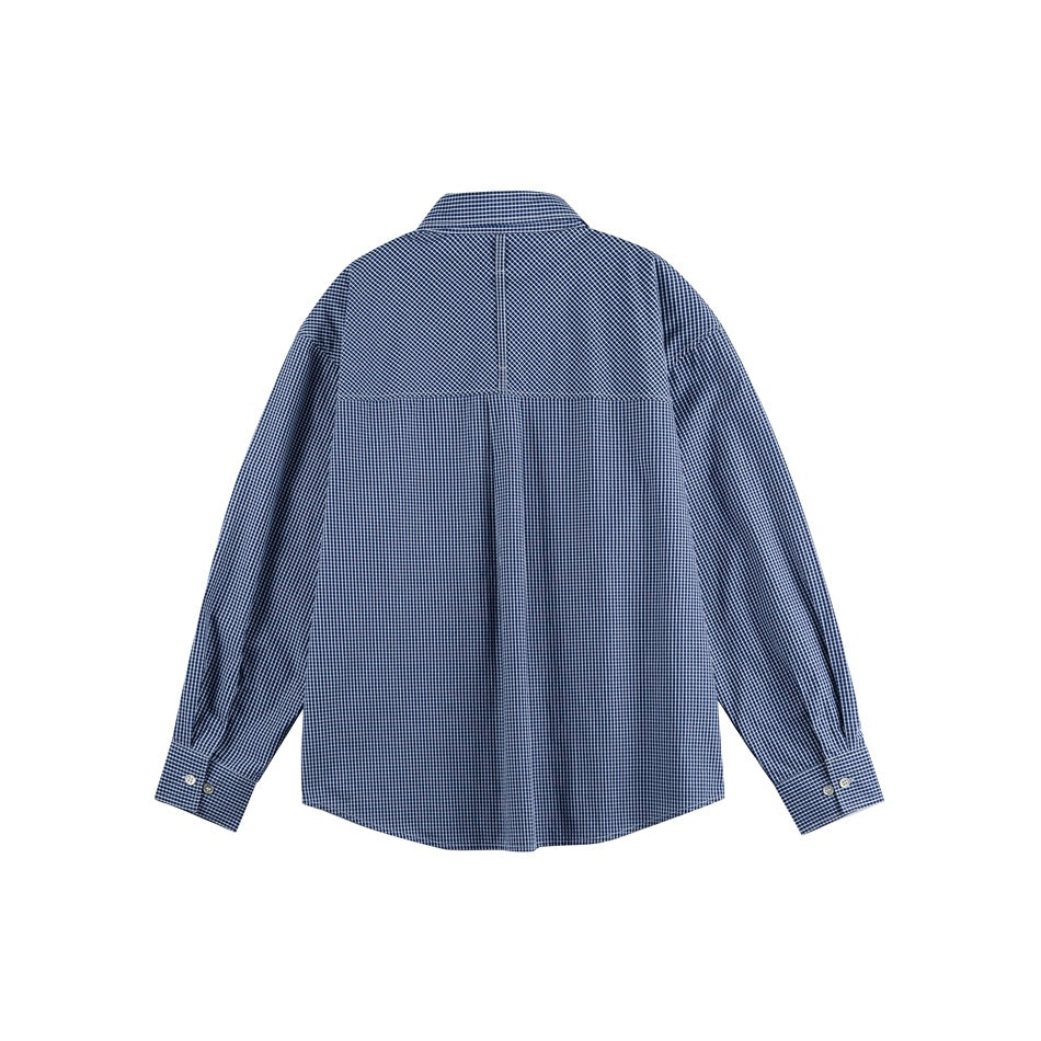 Back view of navy and white check long-sleeve shirt with yoke and center pleat on white background