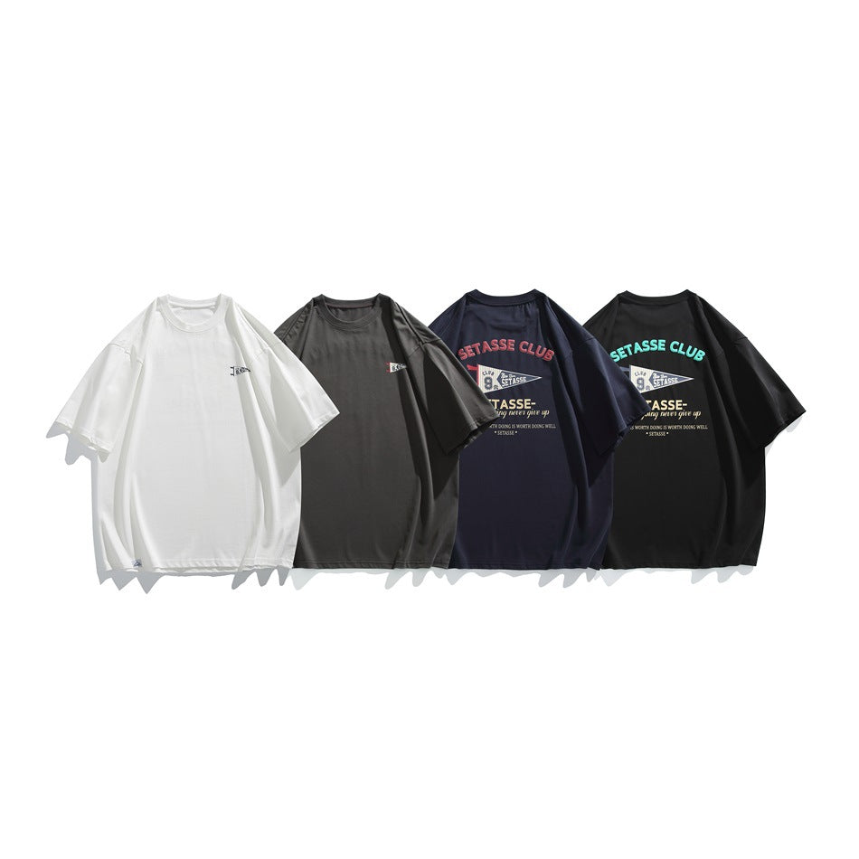 Four short-sleeve T-shirts shown together in white, charcoal, navy, and black; the darker shirts have chest graphics.