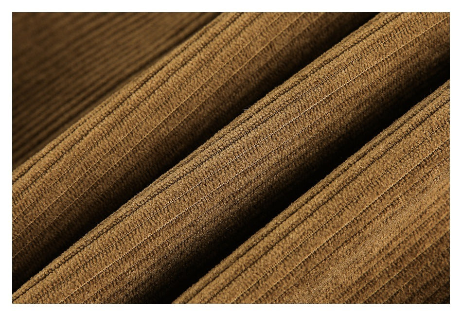 Macro view of the brown jacket's raised parallel ribbed fabric texture.