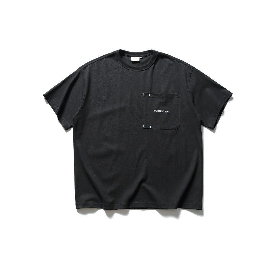 Black short-sleeve crew-neck T-shirt flat lay with a patch chest pocket and small contrast stitch marks