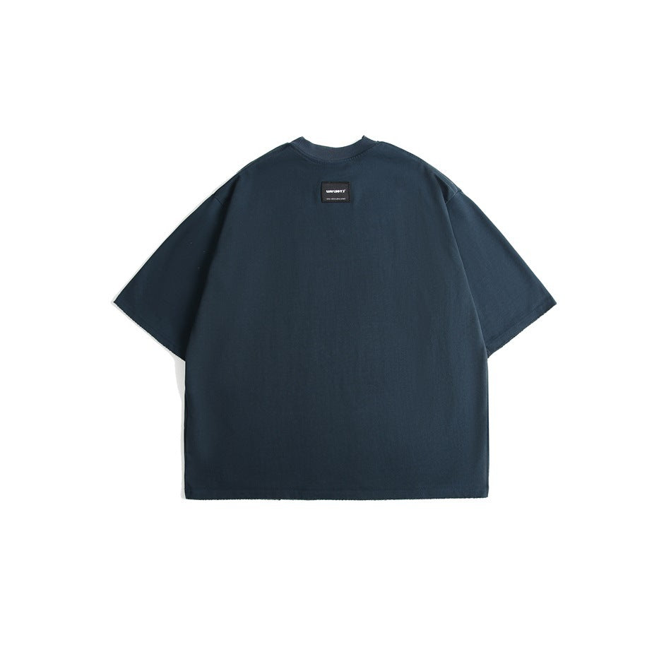 Back view of a dark navy oversized short-sleeve crew-neck T-shirt with a small black label at the upper back.