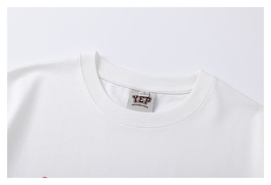 Close-up of the white T-shirt's crew neckline and sewn-in YEP label.