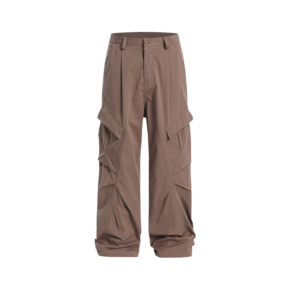 Dusty pink-brown wide-leg cargo pants with large flap pockets and pleated leg detail, front view